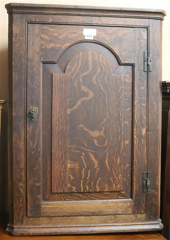 A George III oak corner cupboard, W.65cm